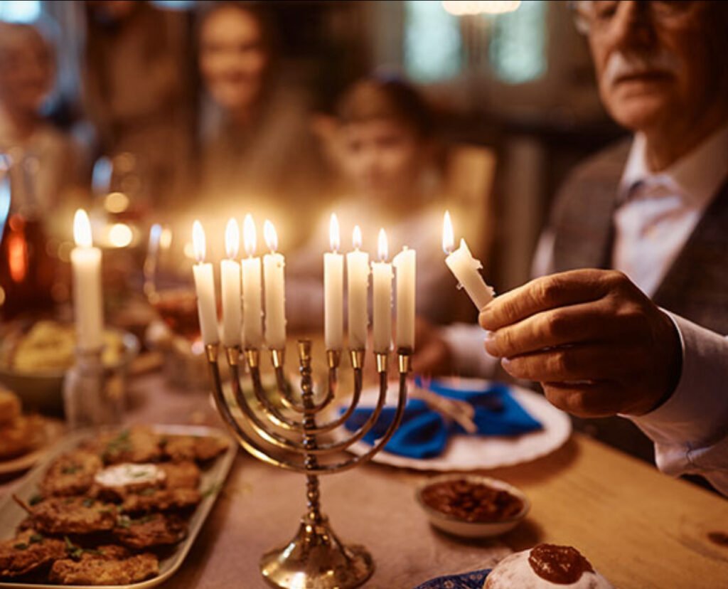 A vibrant Hanukkah celebration in Anchorage featuring a menorah, festive food 