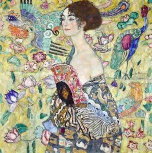Gustav Klimt’s Lady with a Fan (1917-1918), featuring a woman in a patterned gown surrounded by vibrant decorative motif