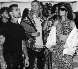 Models showcasing the Just Cavalli Fall 2025 collection, featuring bold prints, streetwear elements, and glamorous details