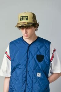 WHIZ LIMITED Spring/Summer 2025 collection featuring modern workwear-inspired jackets, layering, and bold colorways