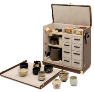 Louis Vuitton Fall/Winter 2025 collection showcasing Damier Phriendship bags and Japanese-inspired trunks on the runway