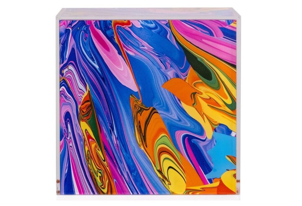 A collection of cube-based artworks displayed at Bonhams London for Cure3 2025, supporting Parkinson’s research