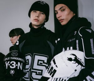 Models backstage at Y-3 Fall/Winter 2025 Paris Fashion Week, showcasing avant-garde sportswear and innovative designs