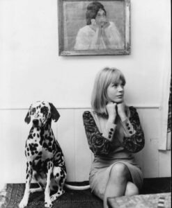 Marianne Faithfull wearing a 1960s mod dress, embodying the effortless chic and rebellious spirit of Swinging London