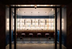 “Elmgreen & Dragset’s K-BAR installation in Thailand’s Khao Yai Art Forest—a sleek, Western-style cocktail bar in a remote natural setting, blending urban luxury with themes of inaccessibility, cultural exchange, and site-specific art.”