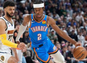 Shai Gilgeous-Alexander celebrating on the court, showcasing joy and skill during his historic NBA scoring streak