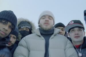 Jack Harlow performing on stage, immersed in deep emotion, reflecting the introspective tone of his new single Set You Free