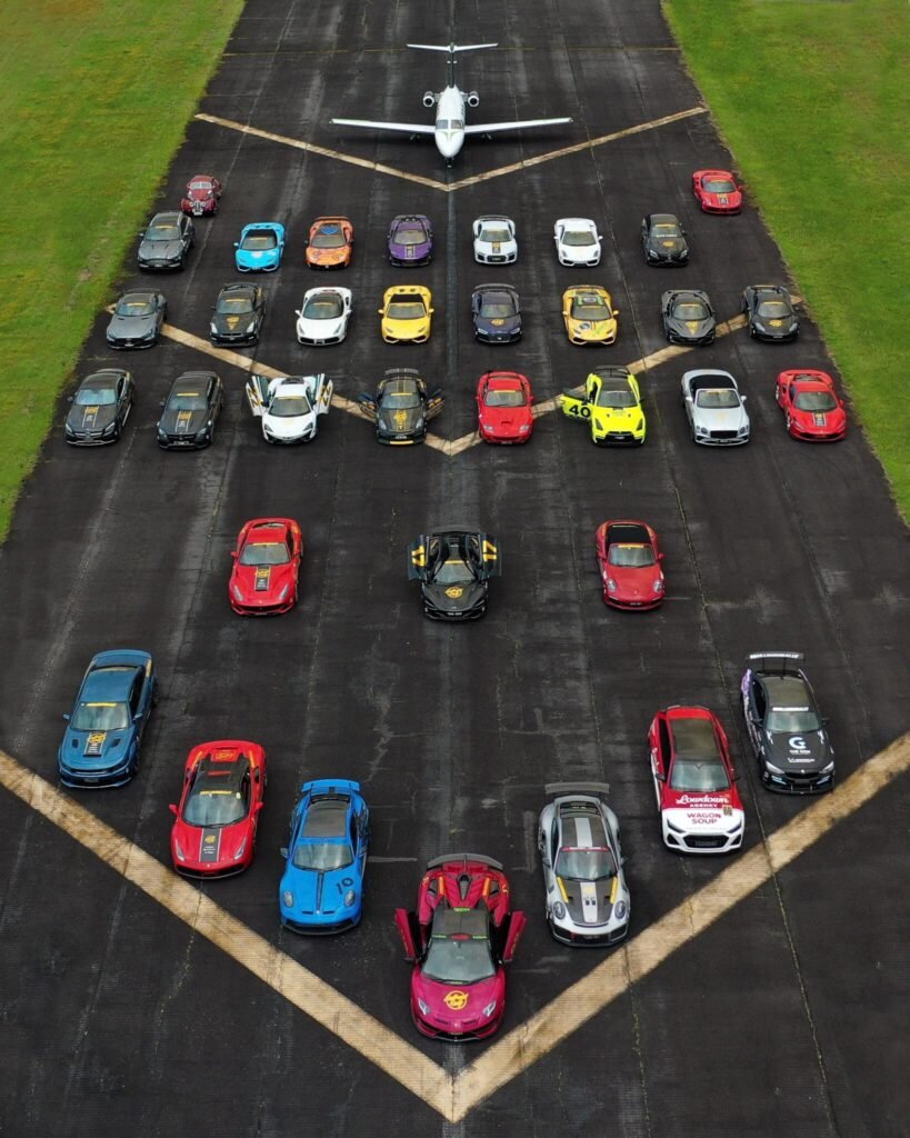 A convoy of high-performance supercars on a scenic Australian highway during Bullrush Rally, blending speed and haute