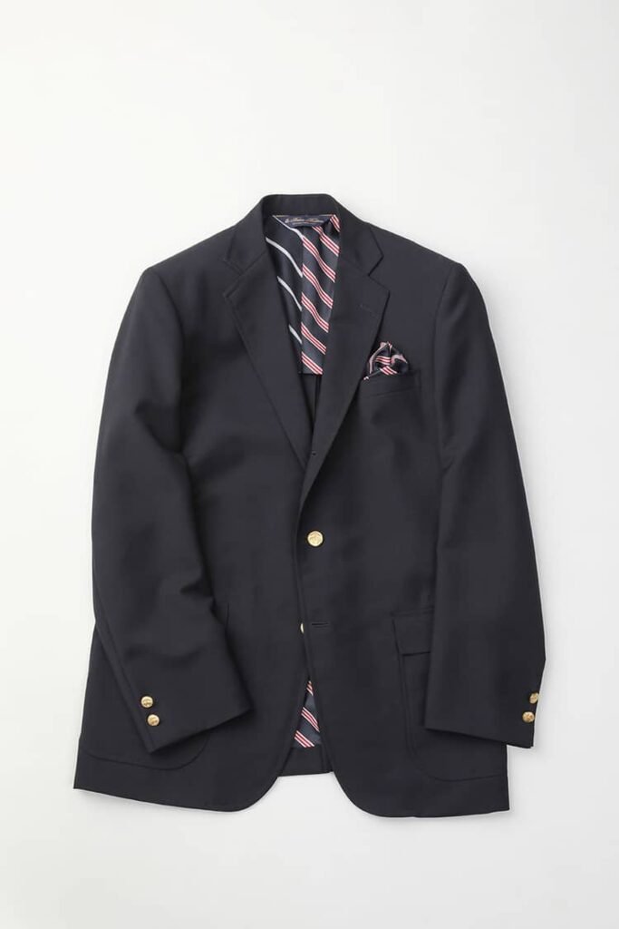 A sophisticated navy blazer featuring dual tags from the Brooks Brothers x SOPHNET. collaboration, showcasing the blend of American traditional and Japanese design