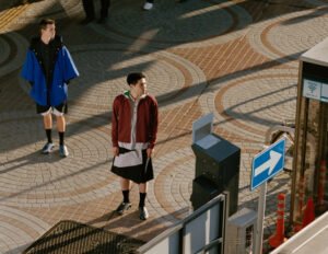 Models sporting ASICS NOVALIS garments, showcasing the collection's urban-inspired aesthetics and adaptable designs