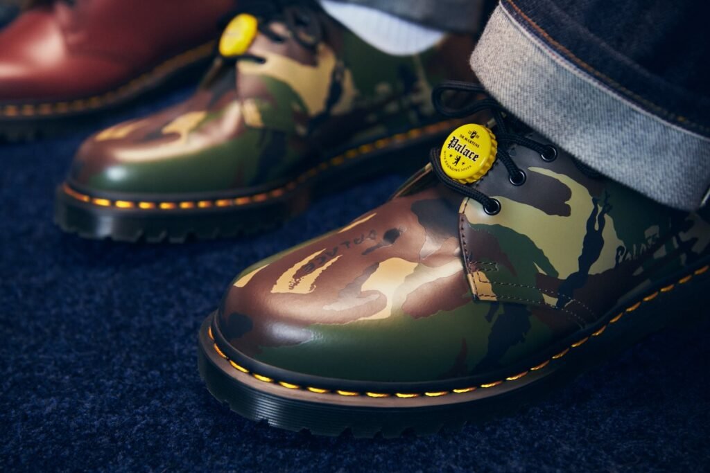 Dr. Martens x Palace 1461 shoes in black, red, and silver, featuring bottle cap motifs and branded heel loop