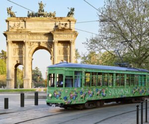 Swarovski’s emerald green tram covered in crystal butterflies and flowers, traveling through the streets of Milan during Design Week