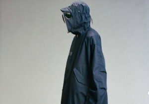 C.P. Company 2025 goggle jacket in Chrome-R fabric with watch lens detail and ergonomic cut, modeled on urban street