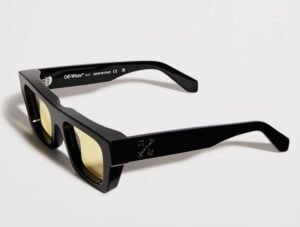 Off-White sunglasses featuring bold acetate frames, “SUNGLASSES” text, and signature arrow logo detailing on temple