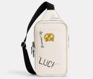 Coach Sullivan Pack featuring black-and-white sketch print, leather trim, front zip pocket, and padded shoulder straps