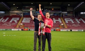 Ryan Reynolds and Rob McElhenney celebrate Wrexham AFC’s historic third promotion, reaching the English Championship in 2025