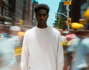 Close-up of Sheep Inc.’s FIBREGEN™ hoodie made with regenerative cotton and Merino wool in Cloud Ash and Storm Blue colors