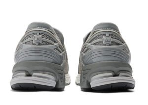 Side view of New Balance 1906L Grey Day shoe featuring suede overlays, mesh panels, and sculpted midsole design