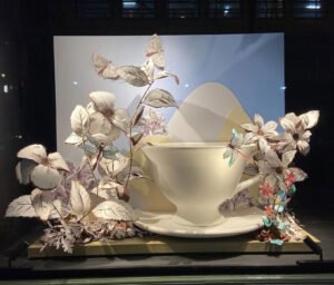 Colorful Fortnum & Mason window display featuring Cath Kidston-Padghan’s Wild Garden tea cups surrounded by floral artwork