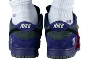 Supreme x Nike SB Dunk Low “Ink, Ink, Iron Grey” sneaker with dark leather panels and rope laces on concrete background