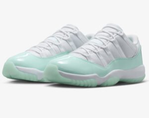 Side profile of Nike Air Jordan 11 Retro Low WMNS in Citrus colorway with patent leather detailing