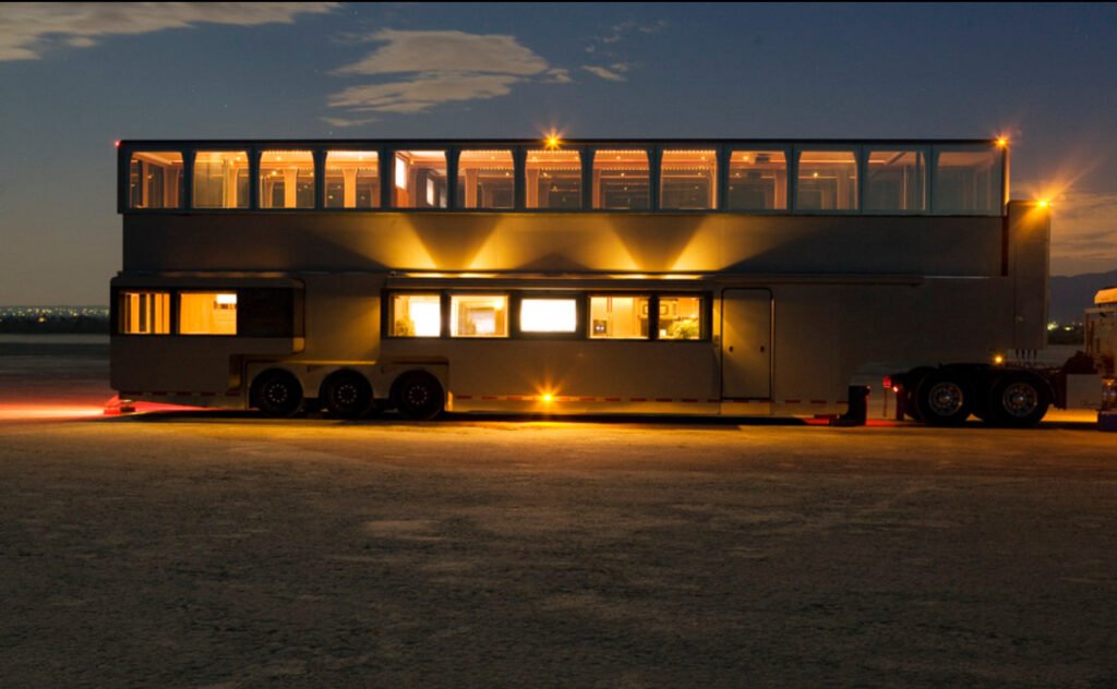 Exterior of Will Smith’s luxury two-story film trailer showing high-end design, leather seating, and custom tech features
