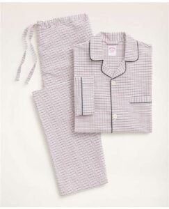 A neatly folded set of Brooks Brothers Long Pajamas in blue and white striped cotton, highlighting classic design and soft texture