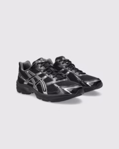 Side view of ASICS Gel-1130 Black Pure Silver sneaker showcasing black mesh upper, silver overlays, and reflective detailing
