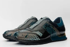 Pair of Milano Snk Green Leather Men Shoes featuring glossy black patent overlays and green reptile-textured leather panels on a white background