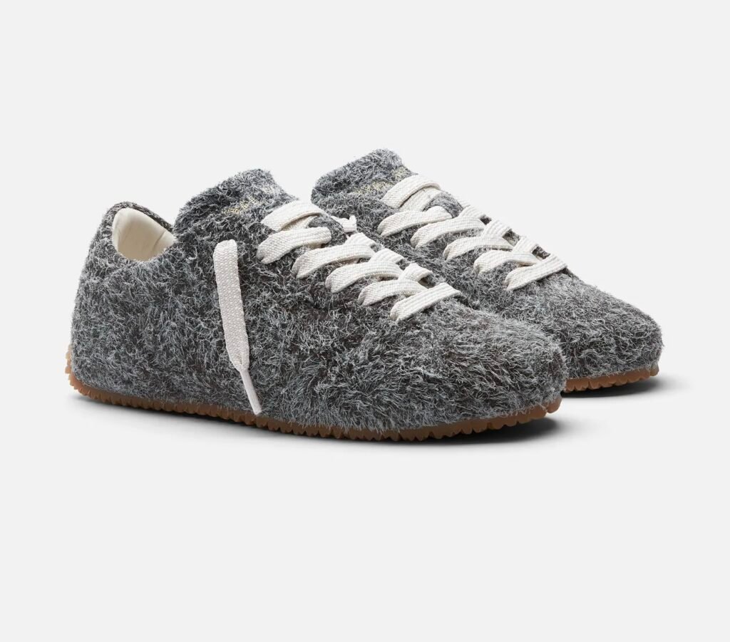 Axel Arigato Tact Runner F3241001 in brushed grey Italian suede with fluffy textured finish, white laces, and gum rubber knit-inspired sole.