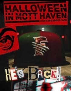 Promotional poster for Topperzstore USA’s “Halloween in Mott Haven” campaign, featuring a dark red and green fitted cap with a claw-mark “F” logo, distressed collage lettering reading “He’s Back!”, and bold red graphics emphasizing Bronx streetwear culture and cap design.