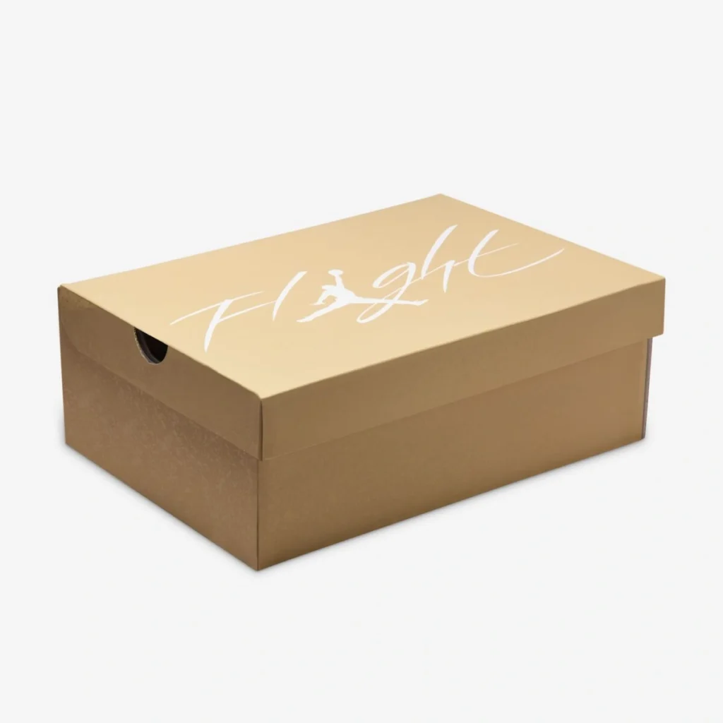 Beige Air Jordan shoebox with white “Flight” script and Jumpman logo printed on the lid, photographed against a clean white background.