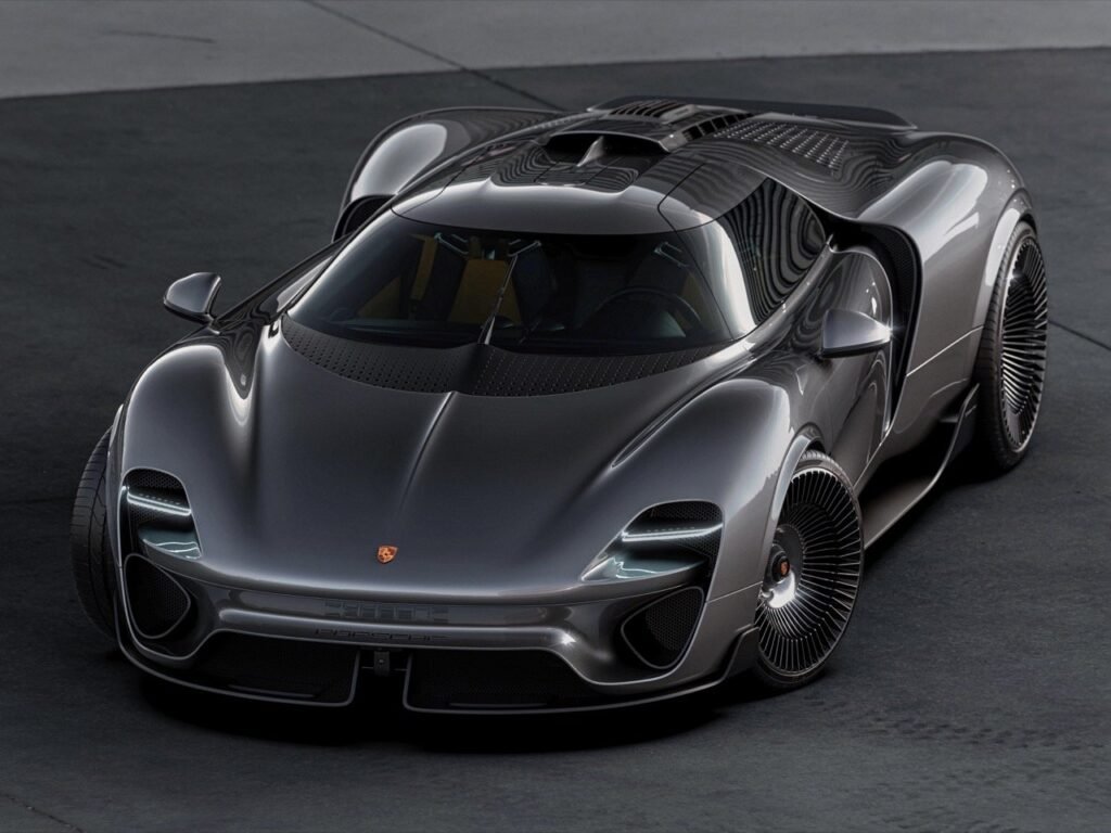 Front three-quarter view of the Porsche 960 GT RS Concept in metallic grey, showcasing its sculpted aerodynamic bodywork, futuristic LED headlights, and turbine-inspired wheels.