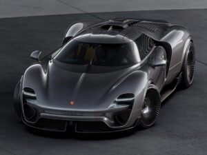 Front three-quarter view of the Porsche 960 GT RS Concept in metallic grey, showcasing its sculpted aerodynamic bodywork, futuristic LED headlights, and turbine-inspired wheels.