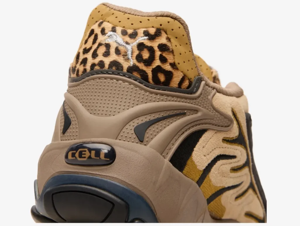 Close-up of the Puma x A$AP Rocky Inhale Leopard Khaki heel showing CELL cushioning badge, embossed detailing, and leopard-print fur panel with stitched white Puma logo