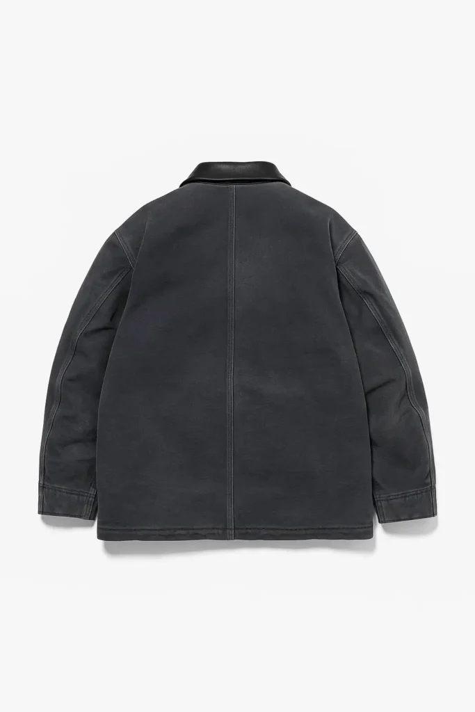 Back view of the AURALEE Product Dyed Organic Cotton Duck Blouson in Faded Black, featuring a central back seam, garment-dyed tonal fading, raglan-style sleeve construction, and a smooth black structured collar