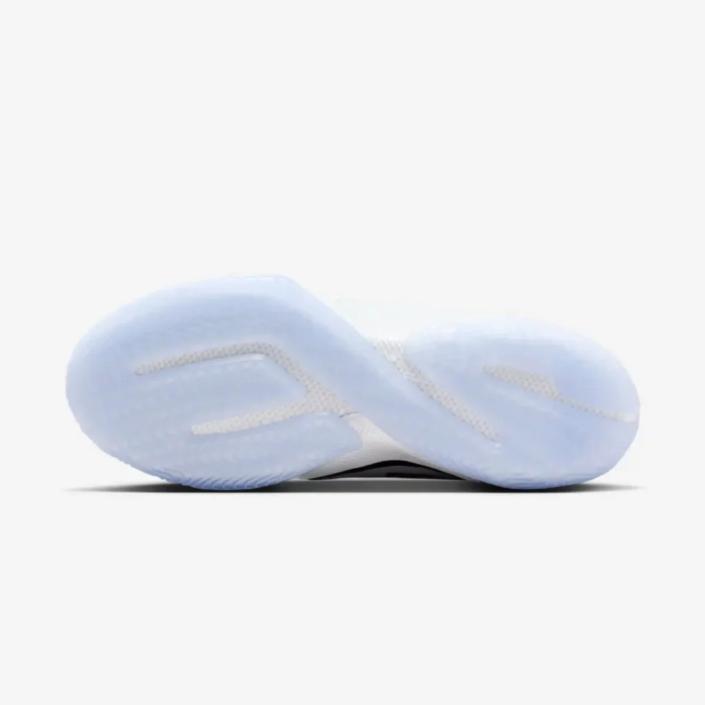 Bottom view of the Nike LeBron 23 “From This Point Forward,” showcasing its translucent icy outsole with a wavy traction pattern and strategically placed grip zones, set against a clean white background