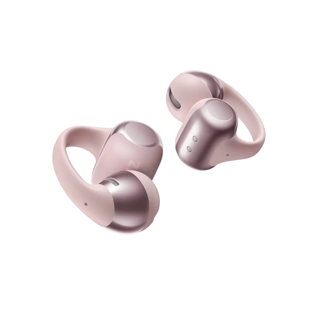Shokz OpenDots One wireless open-ear earbuds in soft rose pink with metallic accents, showcasing their looped ergonomic design and compact, minimalist build for everyday sport and lifestyle use.
