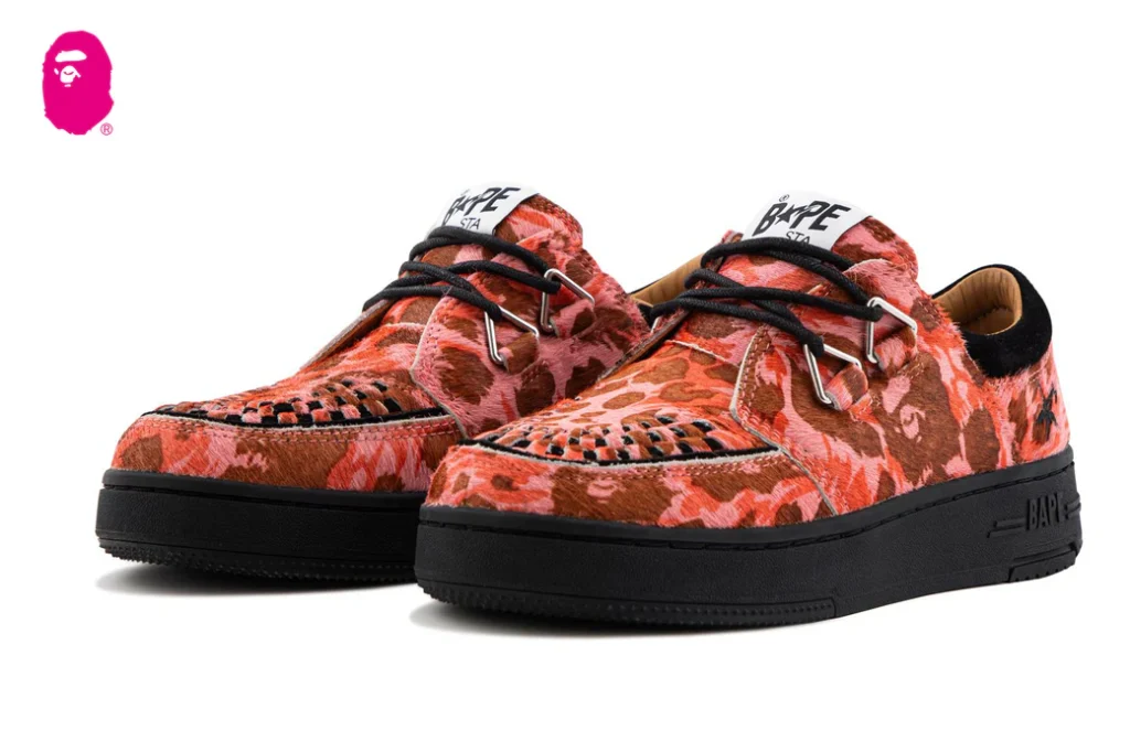 A Bathing Ape CREEP STA shoe in pink camo with chunky sole and metal lace hardware