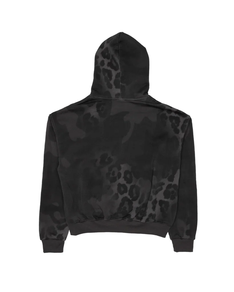 Back view of a black hoodie featuring a subtle, faded black-on-charcoal leopard pattern across the hood, sleeves, and body, with ribbed cuffs and hem