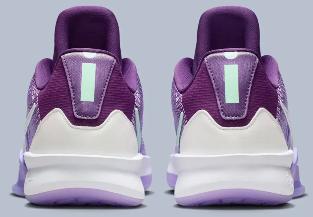 Back view of the Nike Sabrina 3 “Flowers” sneakers showing the purple heel panels, mint-green vertical heel tabs, white heel counters, and lavender outsole, all set against a soft grey background