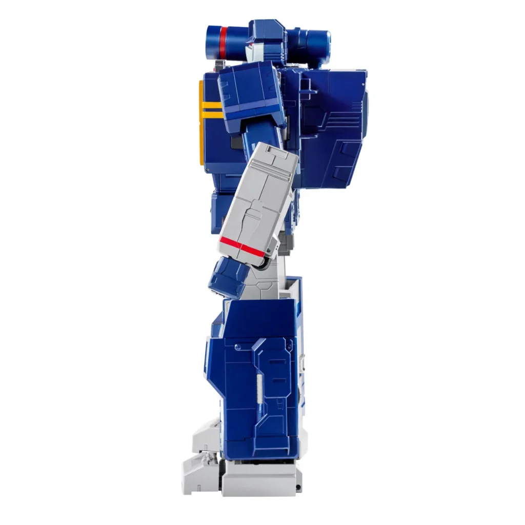 Side view of the Robosen Transformers Soundwave robot figure, showcasing its blue-and-silver G1-inspired armor, articulated limbs, and detailed mechanical paneling along the legs and torso