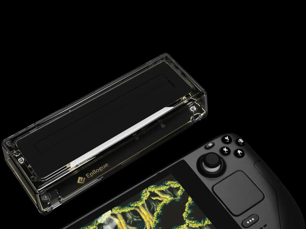 Transparent Epilogue SN Operator USB-C cartridge dock positioned beside a Steam Deck, highlighting its clear acrylic housing, visible internal components, and compact form designed for modern PC and handheld gaming setups