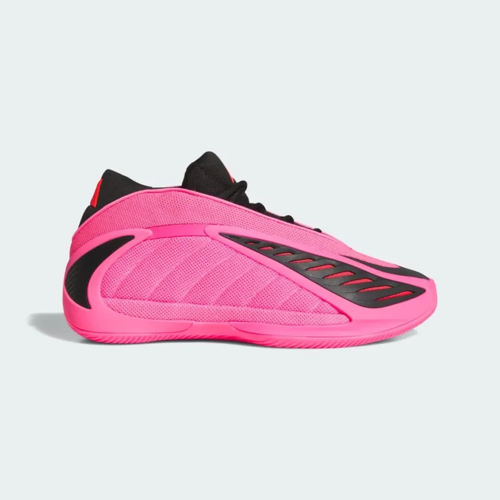 Side profile of the adidas Anthony Edwards 2 “Lucid Pink” basketball shoe, showcasing a bright pink mesh upper with aerodynamic black synthetic overlays, sculpted midsole, and low-top performance silhouette against a clean light background