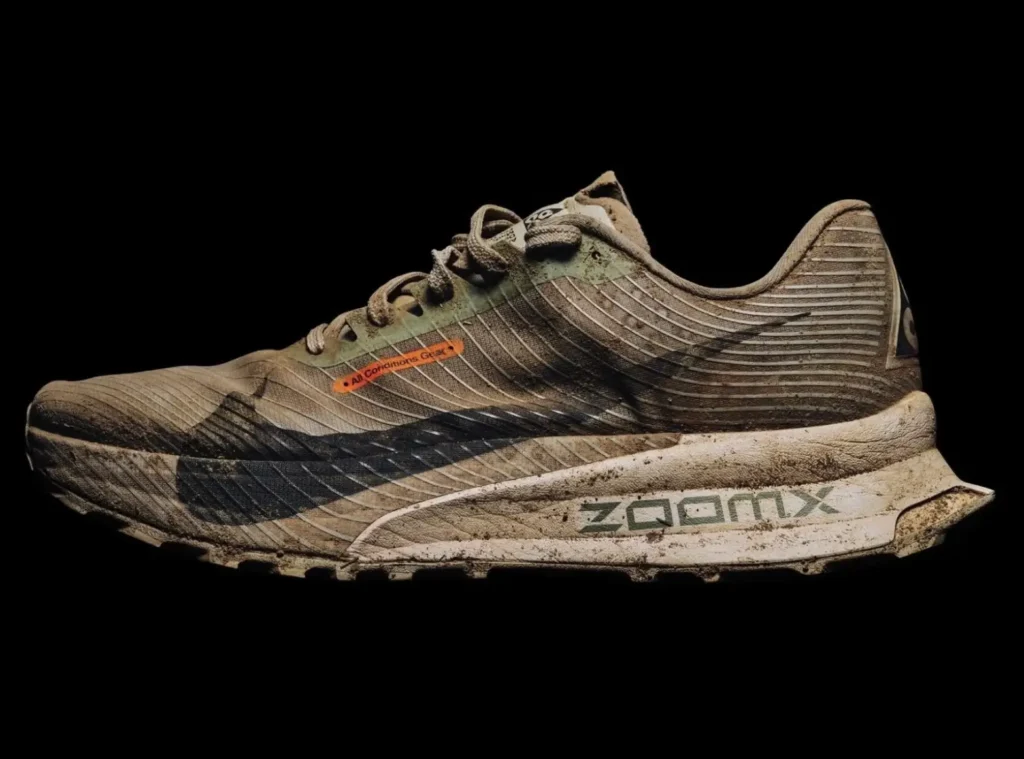 Mud-covered Nike ACG trail running shoe with ZoomX midsole