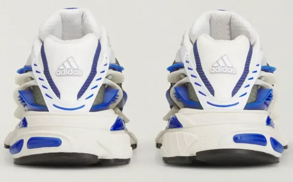 Rear view of the adidas Jellyfish ‘Royal’ sneakers showing dual heel branding, sculpted white midsoles, royal blue cushioning accents, and futuristic layered heel construction inspired by modern performance running design
