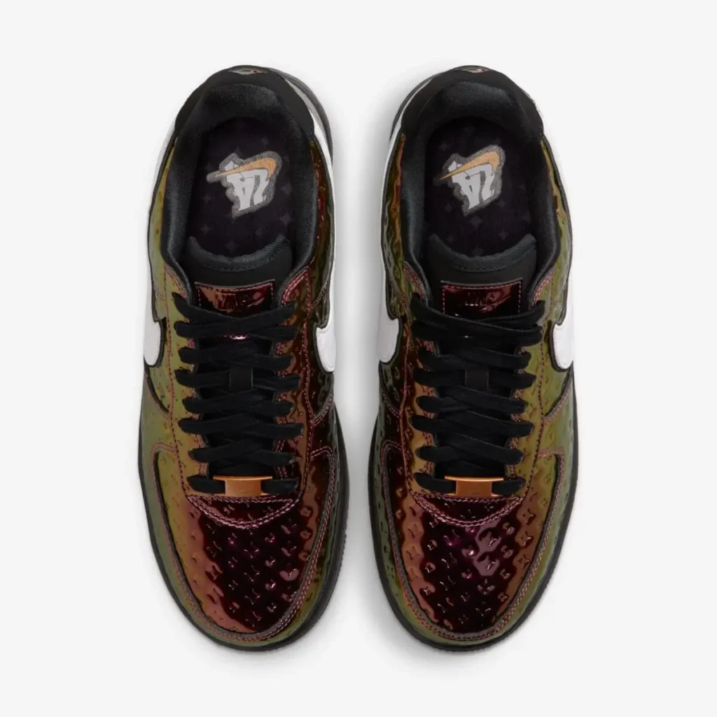 Top-down view of Nike Air Force 1 Low PRM “LA All-Star” sneakers featuring iridescent embossed leather in copper and olive tones, black laces with metallic lace dubraes, white Swooshes, and “LA 24” graphic on the insoles