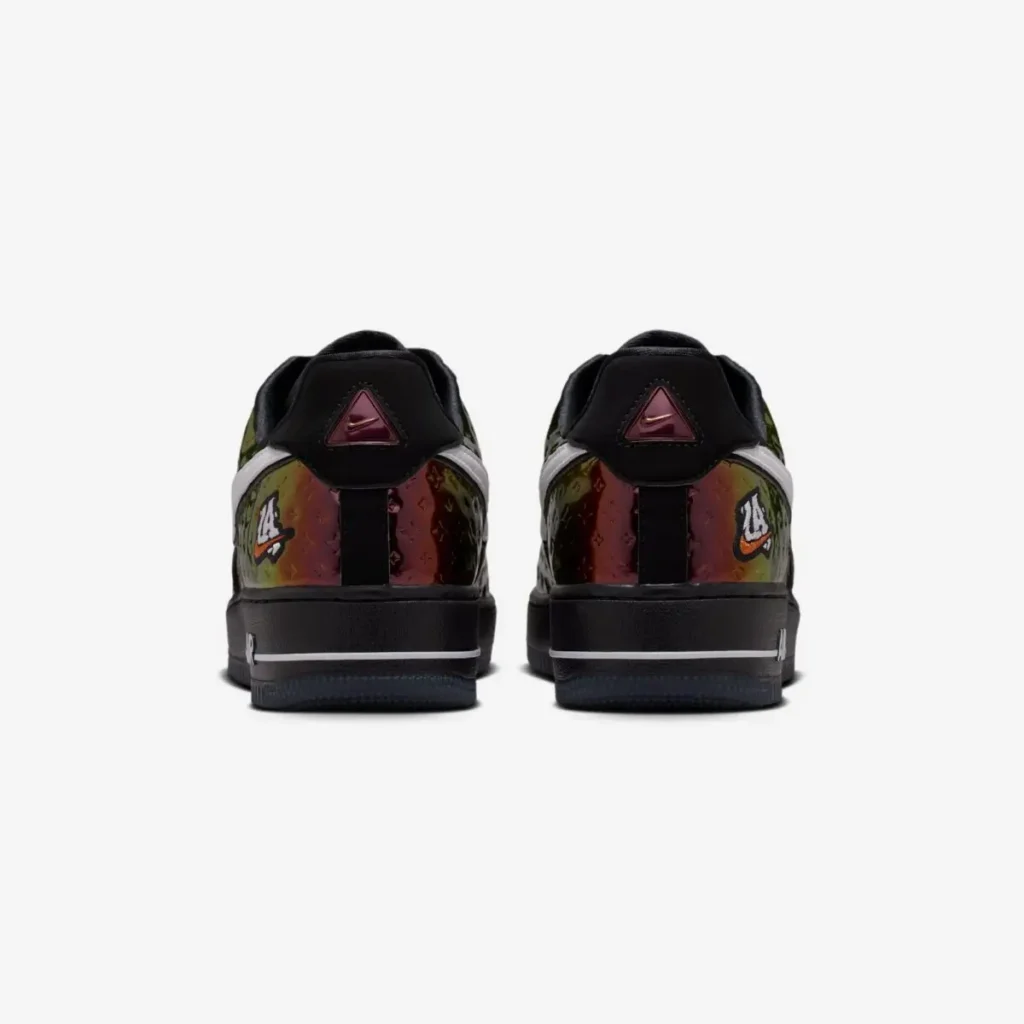 Rear view of Nike Air Force 1 Low PRM “LA All-Star” sneakers featuring iridescent embossed leather heels, black collars, triangular heel badges with Nike branding, “LA 24” embroidered patches, and black midsoles with white stripe detail