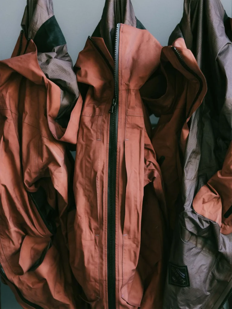 Hand-dyed rust GORE-TEX PRO technical jacket from HAVEN Exploration project featuring tonal variation and waterproof zip closure