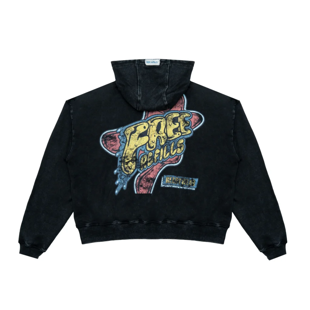 Back view of the Free Refills Amoeba Zip-Up Hoodie in washed black cotton featuring a large distressed “Free Refills” amoeba-style graphic print across the back with vintage-style texture and ribbed hem and cuffs